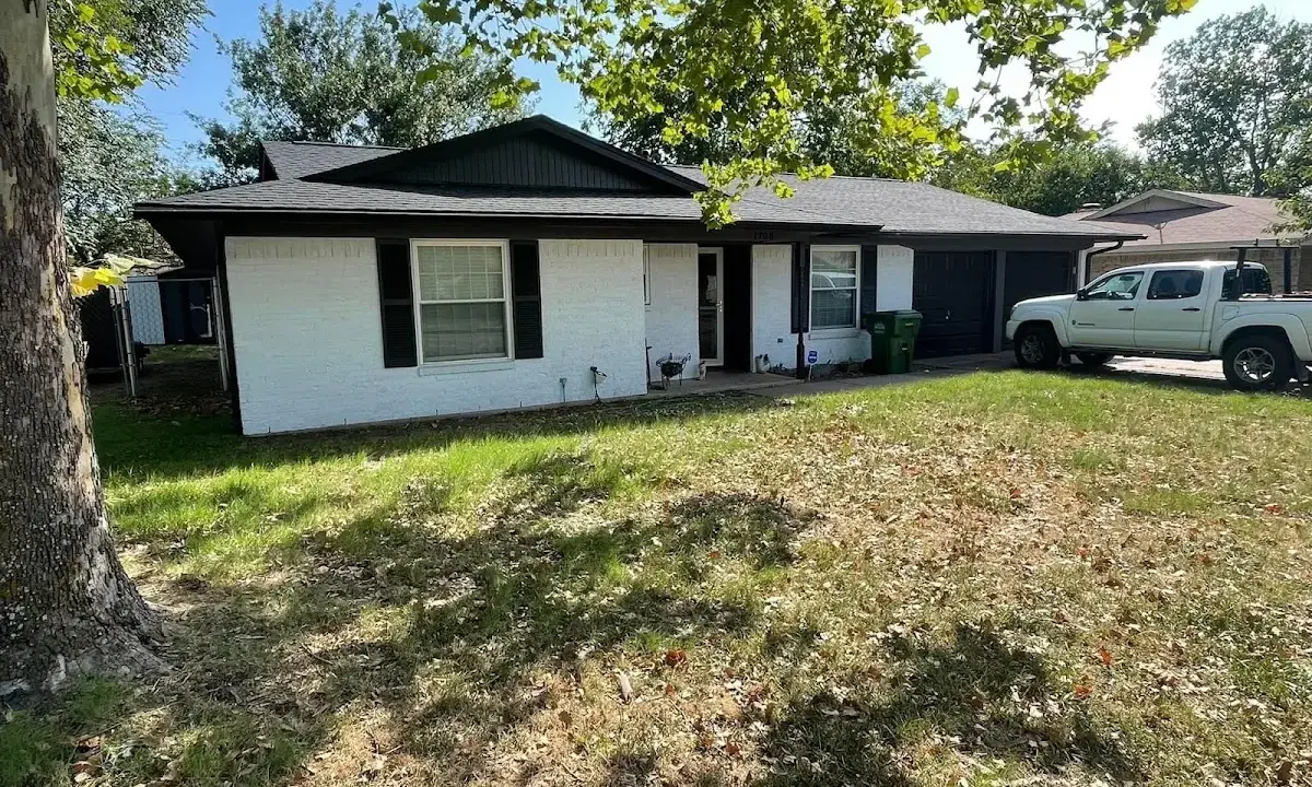 Professional roofing crew working on a residential roof in Oak Park